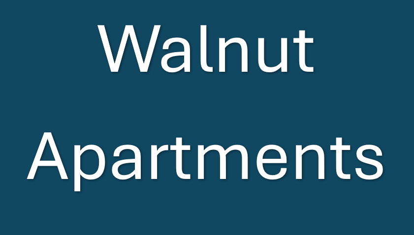 A blue sign with the words Walnut Apartments.